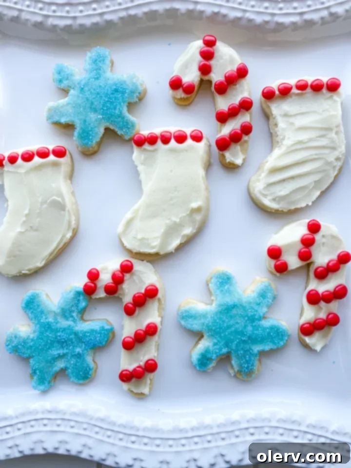 Foolproof Cut-Out Sugar Cookies 2 Perfectly baked round sugar cookies with crisp edges and soft centers, ready for decorating