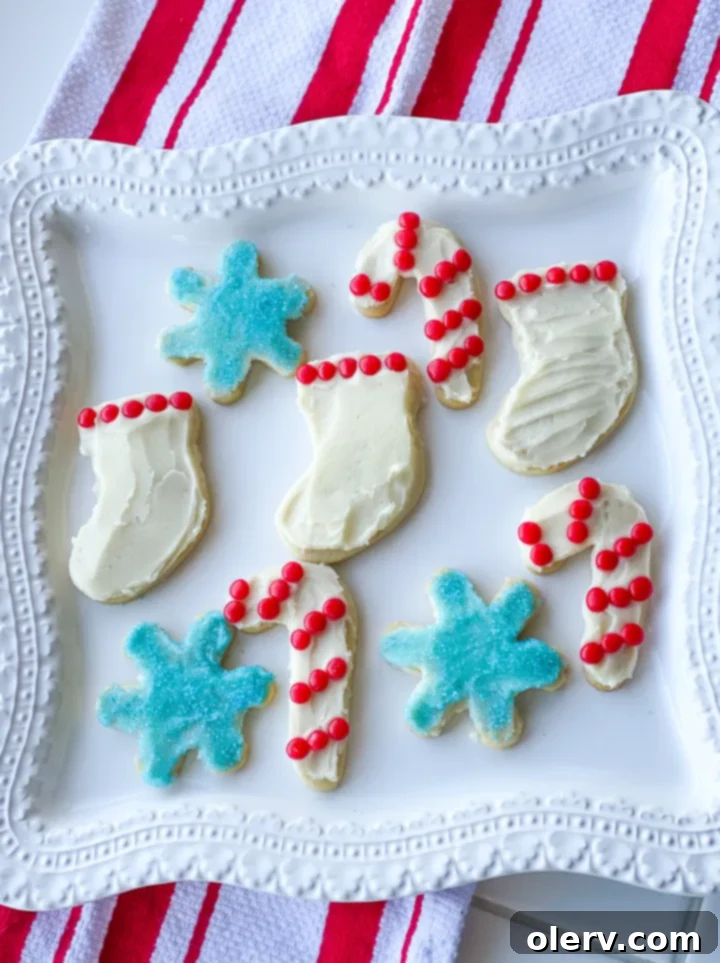 Foolproof Cut-Out Sugar Cookies 3 Close-up of baked sugar cookies on a wire rack, cooling down