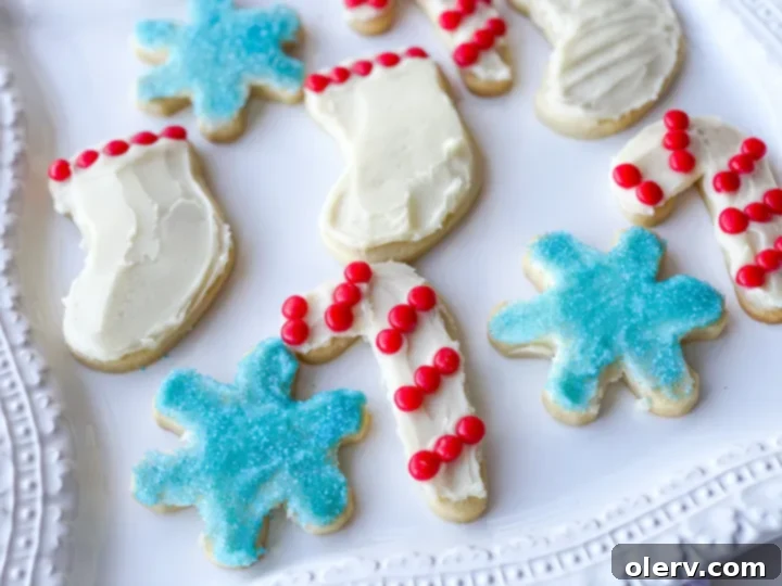 Foolproof Cut-Out Sugar Cookies 4 Assorted cookie cutters laid out on a baking surface, ready to be used