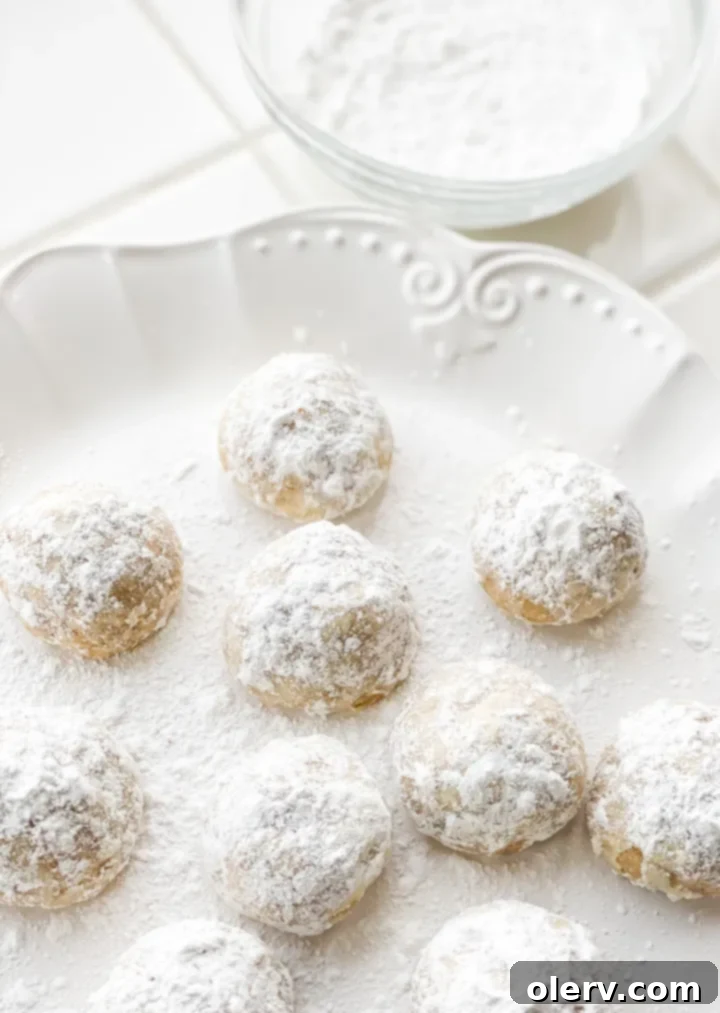 Fiesta Snowball Delights 8 A plate of Mexican Wedding Cookies with a festive background