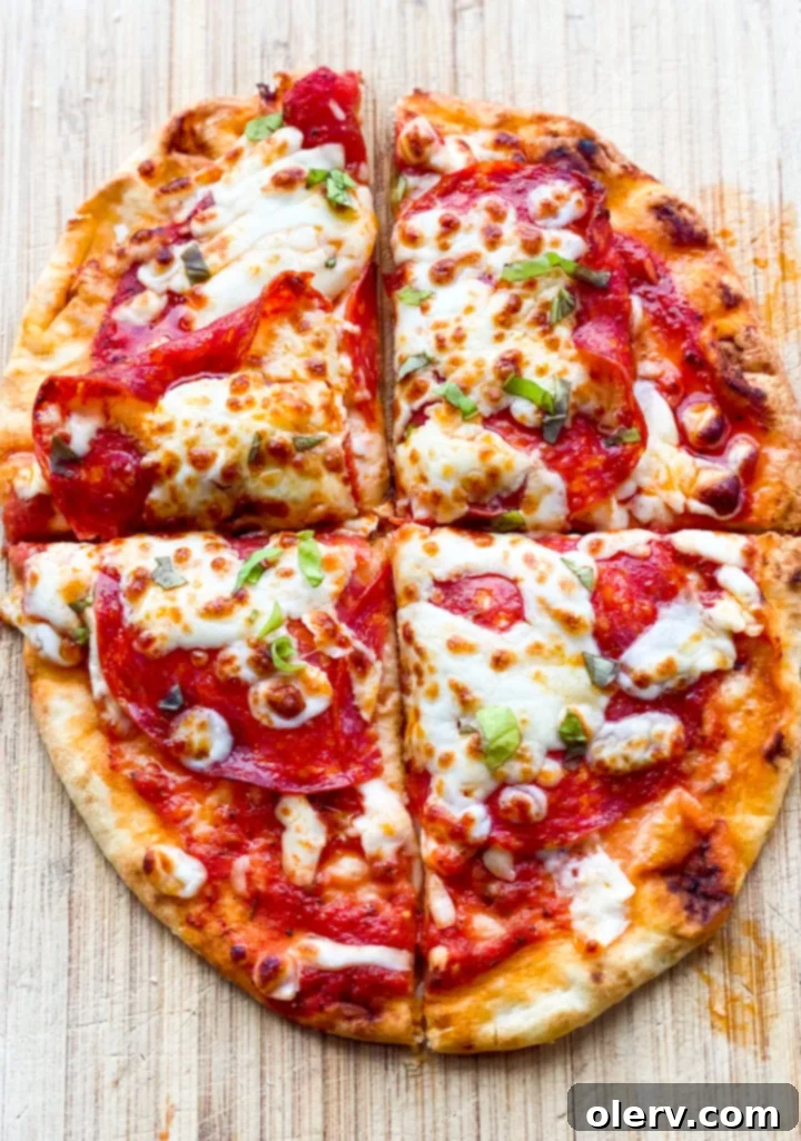 Crispy Air Fryer Pizza 8 Air Fryer Pizzas recipe card image showing a finished pepperoni pizza