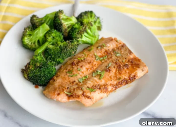 Easy Air Fryer Salmon and Veggies 2 Delicious Air Fryer Salmon and Broccoli on a white plate