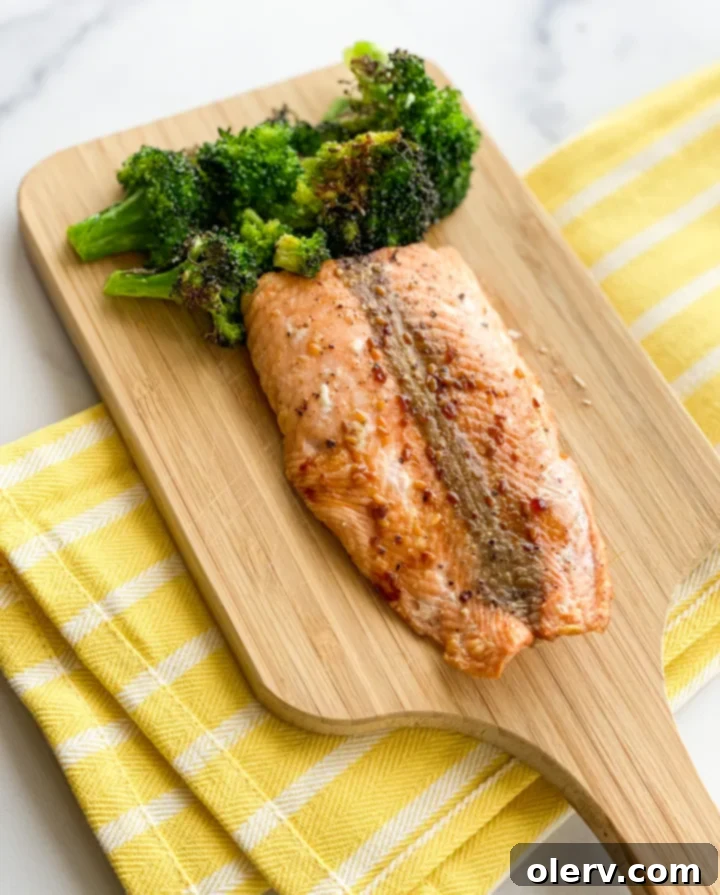 Easy Air Fryer Salmon and Veggies 8 Close-up of a perfectly cooked Air Fryer Salmon and Broccoli meal