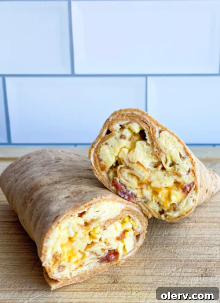 Close-up of the delicious filling of scrambled eggs, bacon, and cheese inside the wrap
