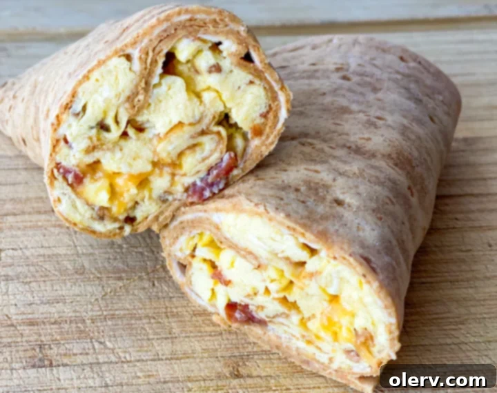 Ingredients for Bacon, Egg, and Cheese Breakfast Wrap laid out on a cutting board