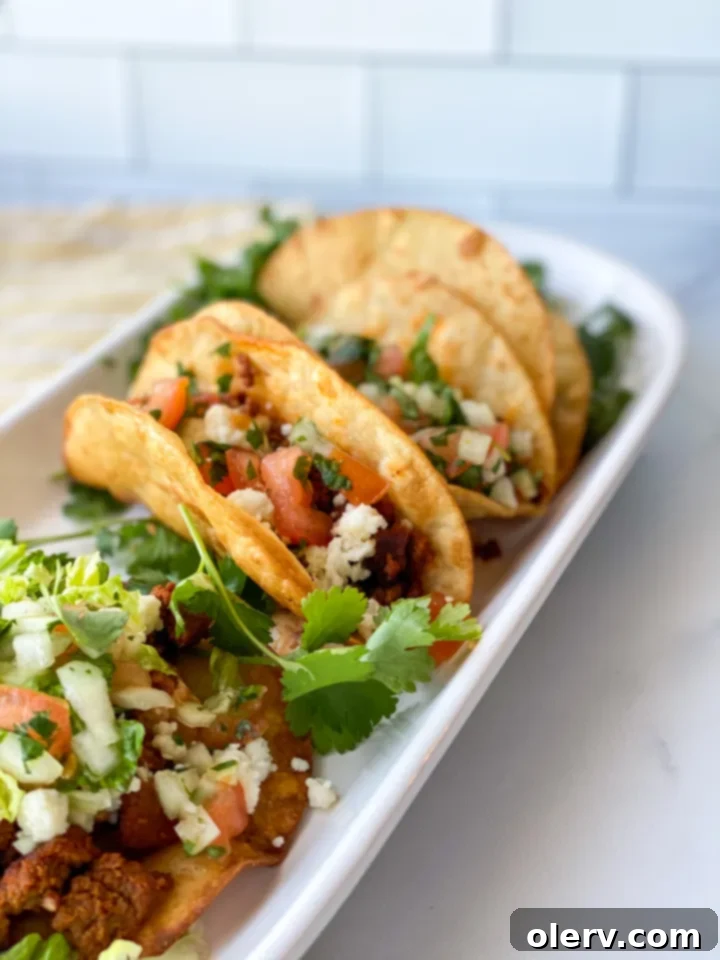 Golden homemade crispy taco shells ready to be filled.