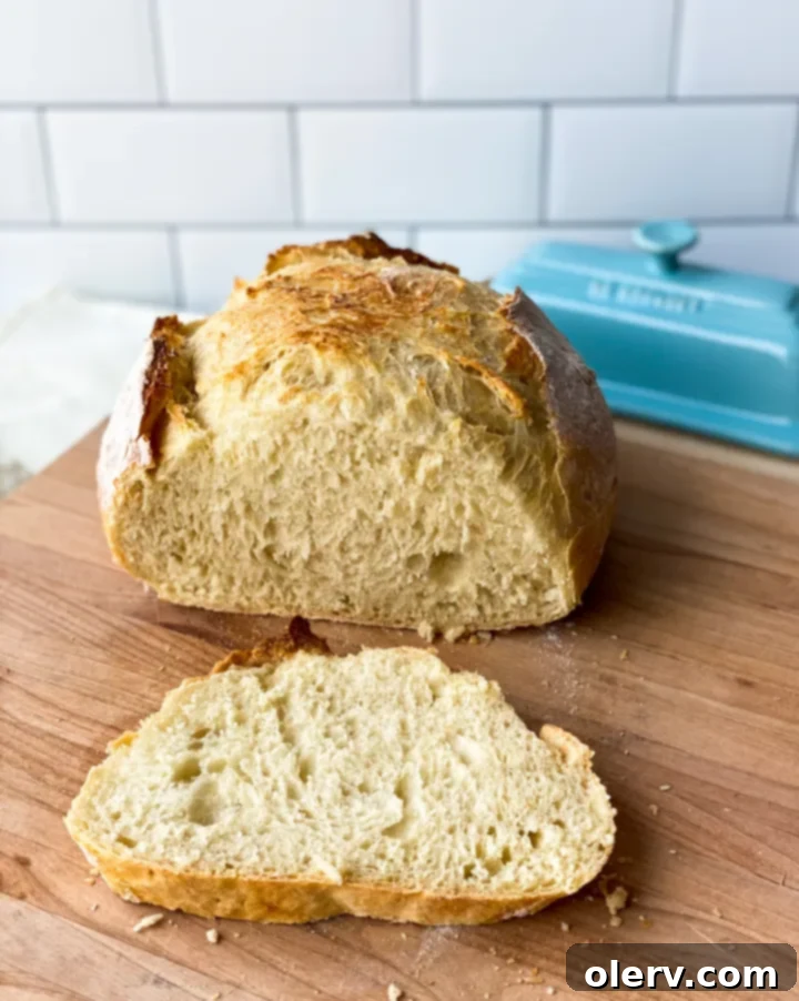 Baking Bread Made Simple 3 Close-up of a rustic loaf of homemade bread, showing crispy crust and porous interior