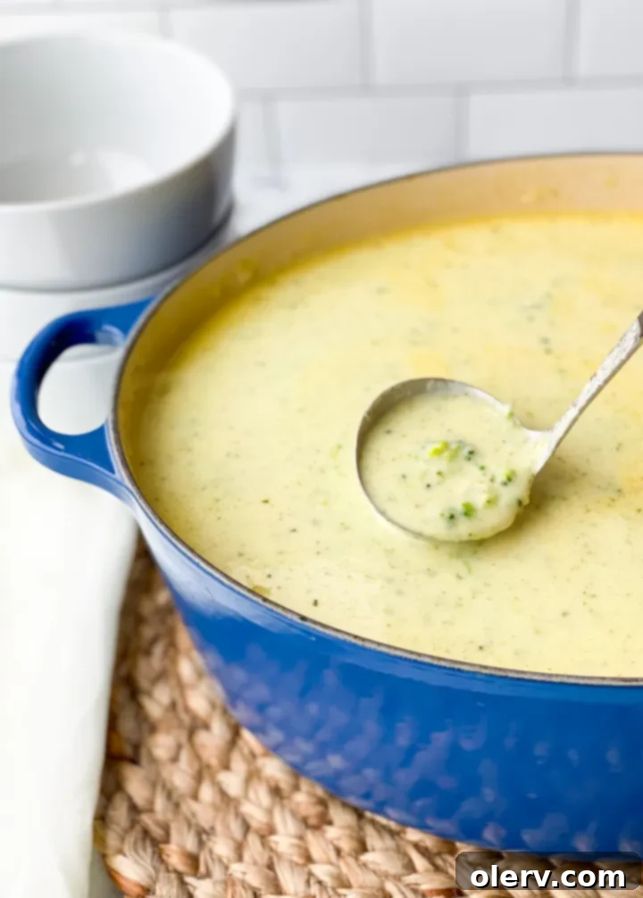 Quick Creamy Broccoli Cheddar Soup 5 The cooking process for broccoli cheese soup, showing softened onions in a pot with butter, the aromatic base for the soup.