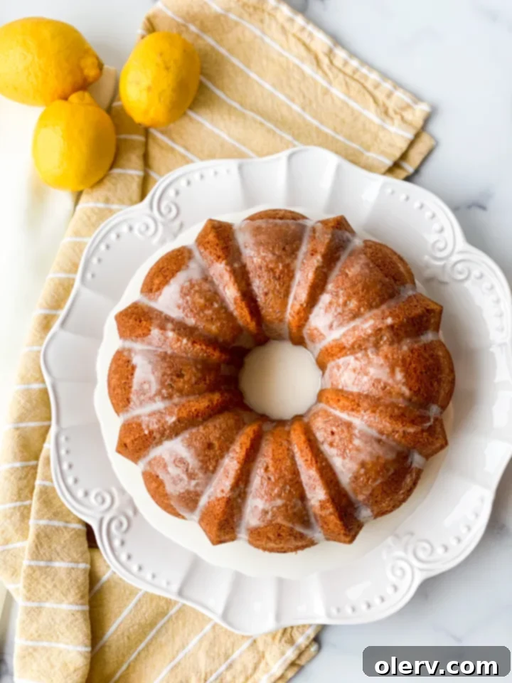 Limon Soslu Haşhaşlı Kek 5 The Bundt cake batter poured into a meticulously greased bundt pan, ready for baking.