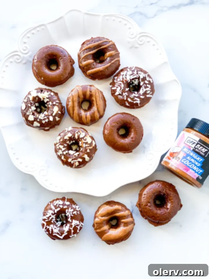 Almond Coconut Donuts: A Midnight Delight 2 Delicious Midnight Almond Coconut Donut, perfectly glazed and topped with shredded coconut and chopped almonds.
