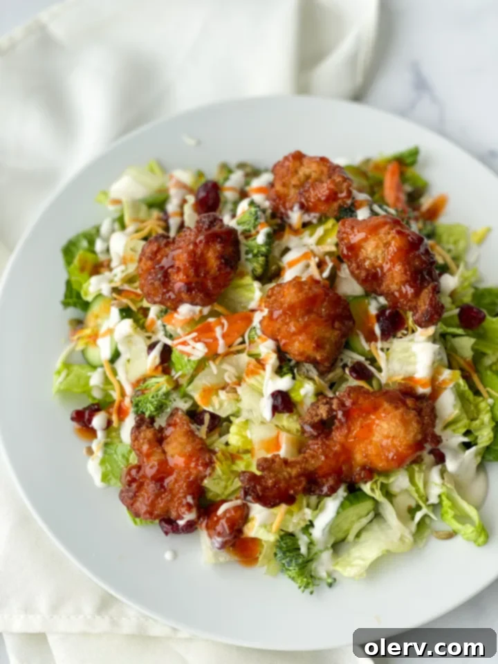 Golden Glaze Chicken Salad 2 Close-up of Winger's Copycat Sticky Chicken Salad with crisp lettuce and sticky chicken