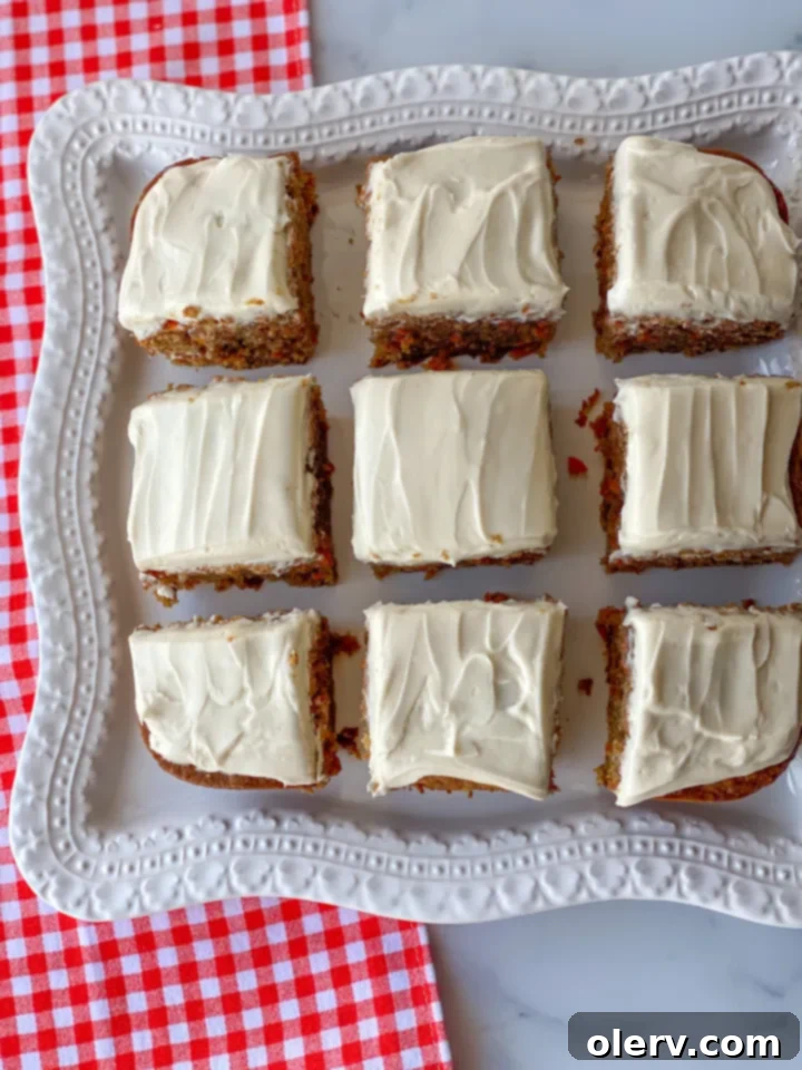 No-Fuss Carrot Cake Bars 4 Ingredients for carrot cake bars, including grated carrots, spices, and wet ingredients, neatly laid out.
