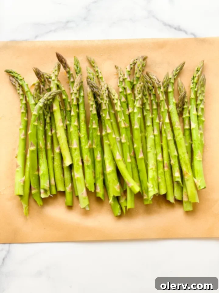 Perfectly Crispy Air Fryer Asparagus 6 A basket-style air fryer, sleek and modern, ready for cooking.