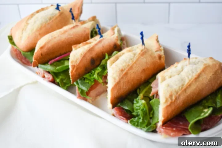 Artisan Baguette 6 The fully assembled and closed French baguette sandwich, showcasing its delicious potential, positioned on a cutting board ready for slicing.