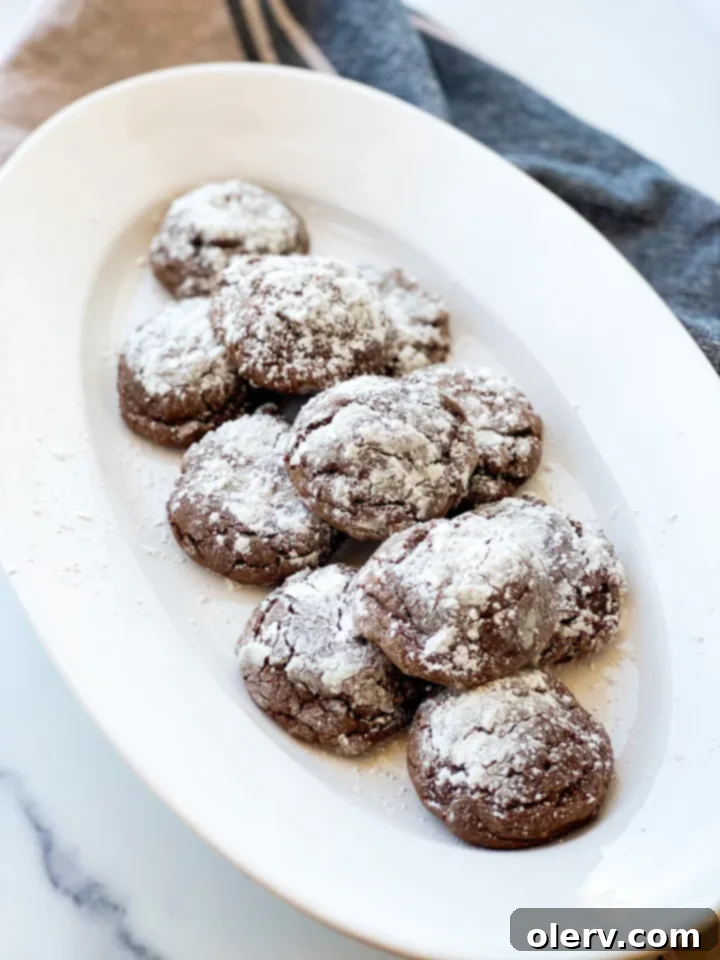Easy Cake Mix Crinkle Cookies 4 Close-up of the simple ingredients needed for cake mix crinkle cookies: cake mix, shortening, eggs, and powdered sugar.