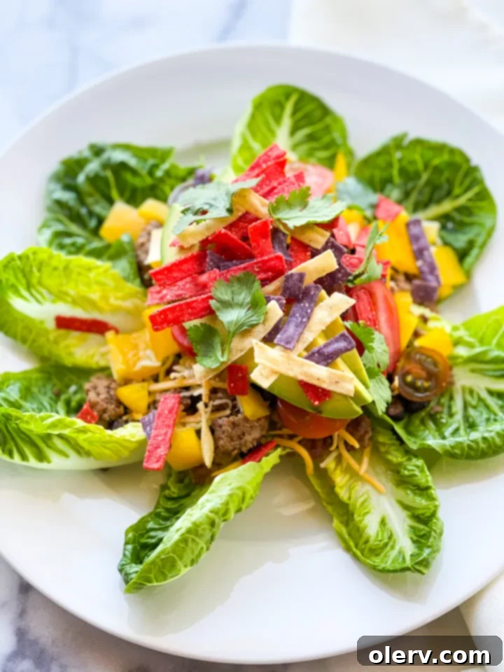Vibrant Fiesta Taco Salad 5 A bowl of creamy, green cilantro tomatillo salad dressing, highlighting its smooth texture and vibrant color.