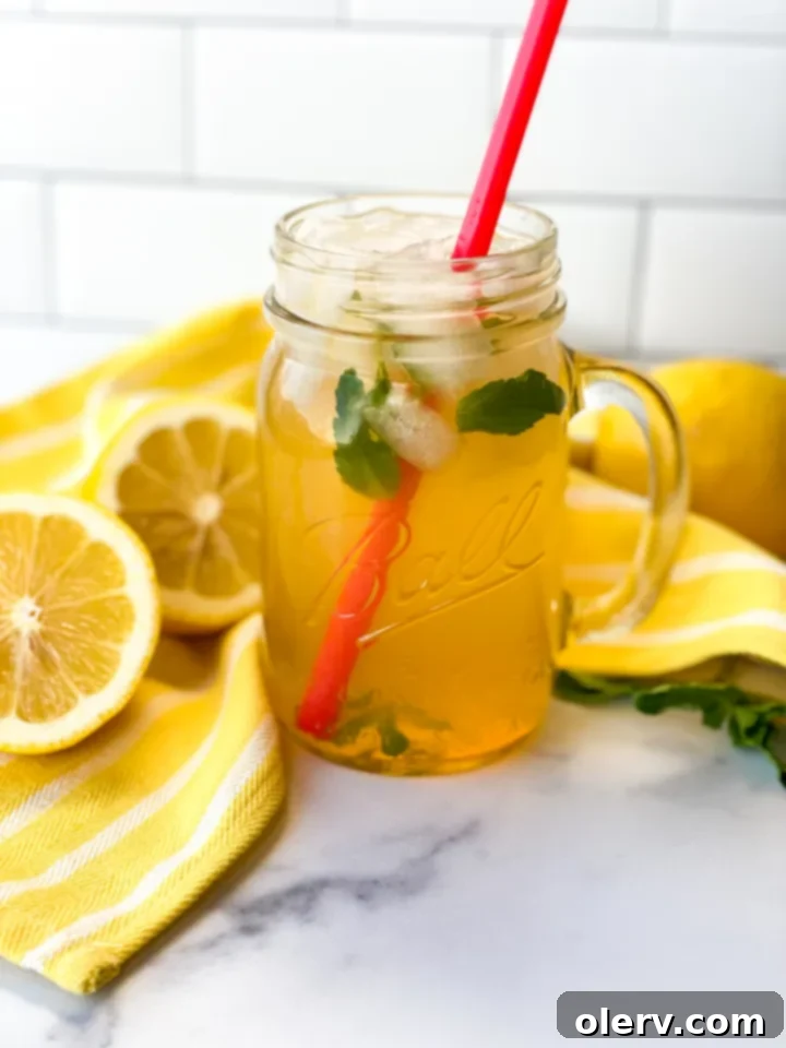 Golden Honey Apple Lemonade 2 Glass of Honey Apple Lemonade with fresh mint and apple slices