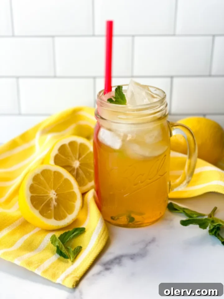 Golden Honey Apple Lemonade 8 Another view of a glass of Honey Apple Lemonade with garnishes