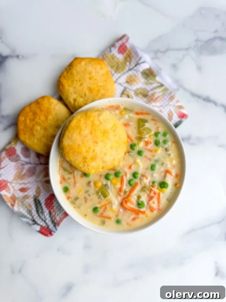 Close-up view of fresh ingredients like onions, carrots, celery, and garlic for chicken pot pie soup