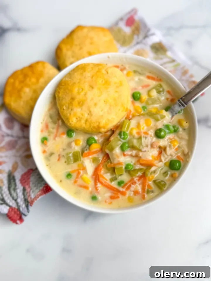 Chicken Pot Pie Soup with a biscuit garnish