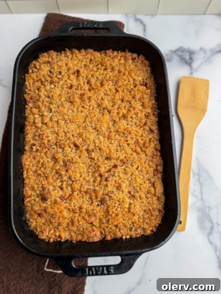 Golden Sweet Potato Delight 3 Close-up view of the sweet potato casserole, highlighting its creamy texture and crunchy pecan topping.
