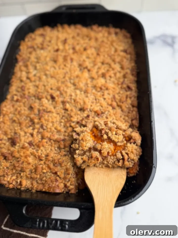 Golden Sweet Potato Delight 4 Selection of fresh ingredients laid out for making sweet potato casserole, including sweet potatoes, butter, sugar, pecans, and eggs.