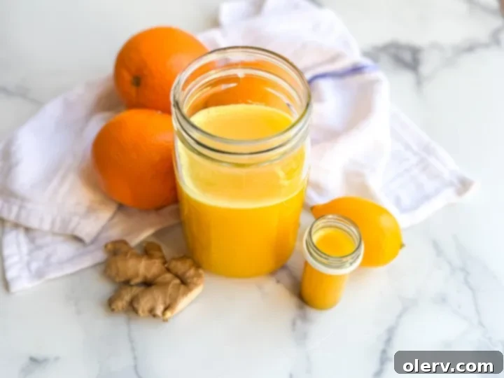 Homemade Ginger Immunity Boosters 5 Pouring homemade ginger immunity shots