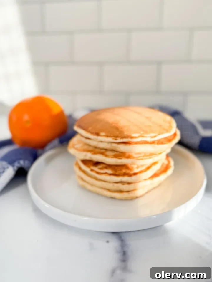 Buttery Fluffy Pancakes 5 Stack of freshly cooked buttermilk pancakes with syrup and butter